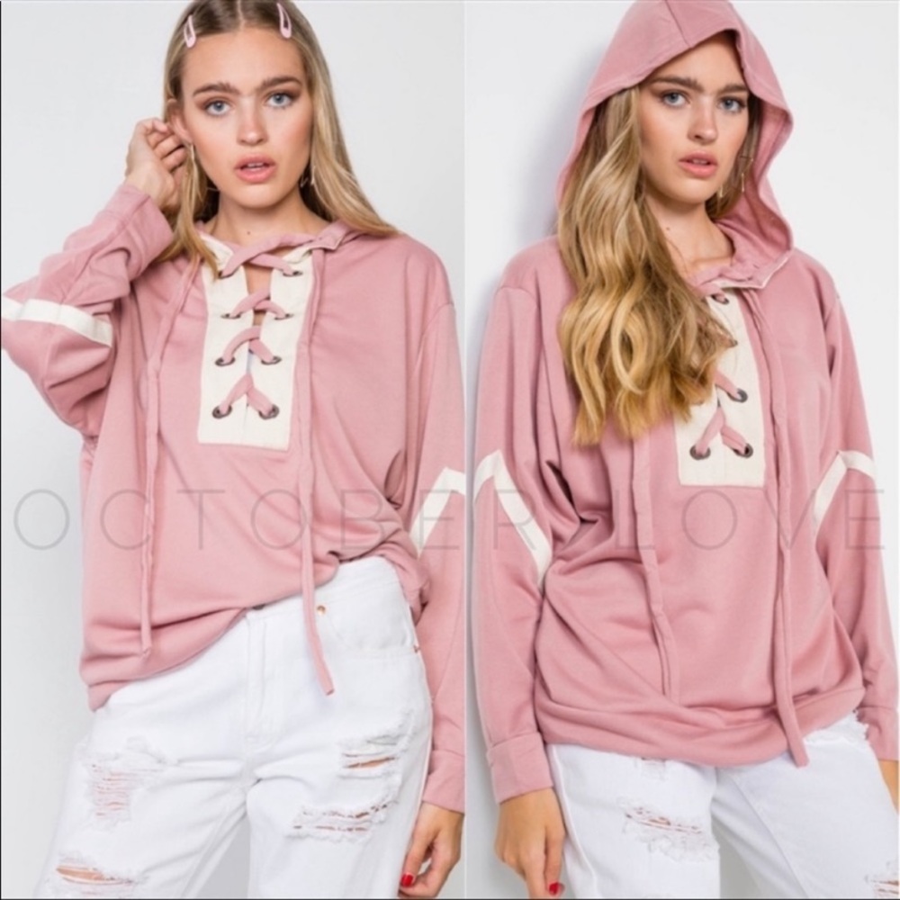 Pink knit hoodie.